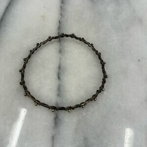 Silver tone wire wrapped bangle bracelet